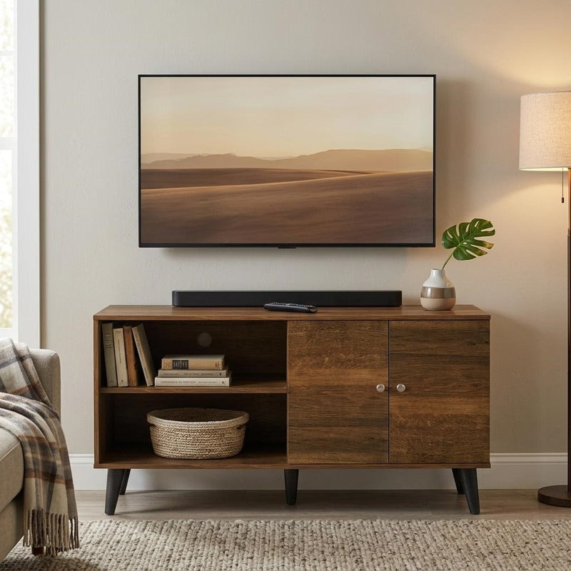 Modern brown TV stand styled in a warm living room with wall-mounted TV