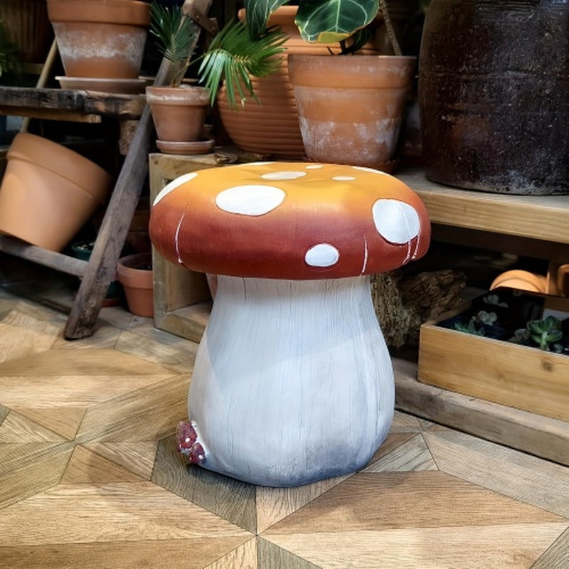 Resin mushroom garden stool displayed beside porch planters