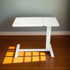 Front view of white height adjustable overbed table