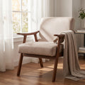 Soft beige accent chair with throw blanket in sunny living room
